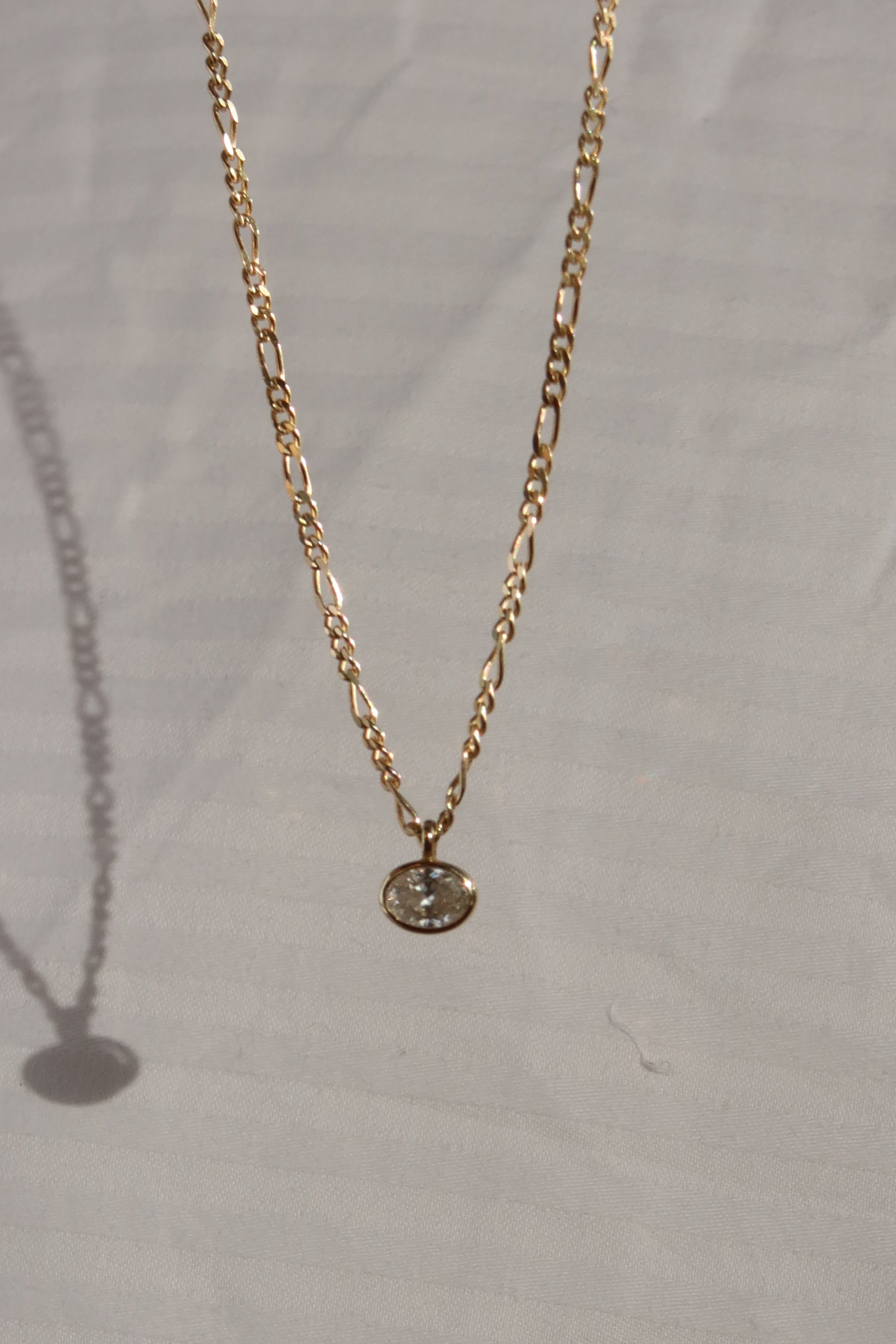 oval lab diamond pendant in 10 karat yellow gold