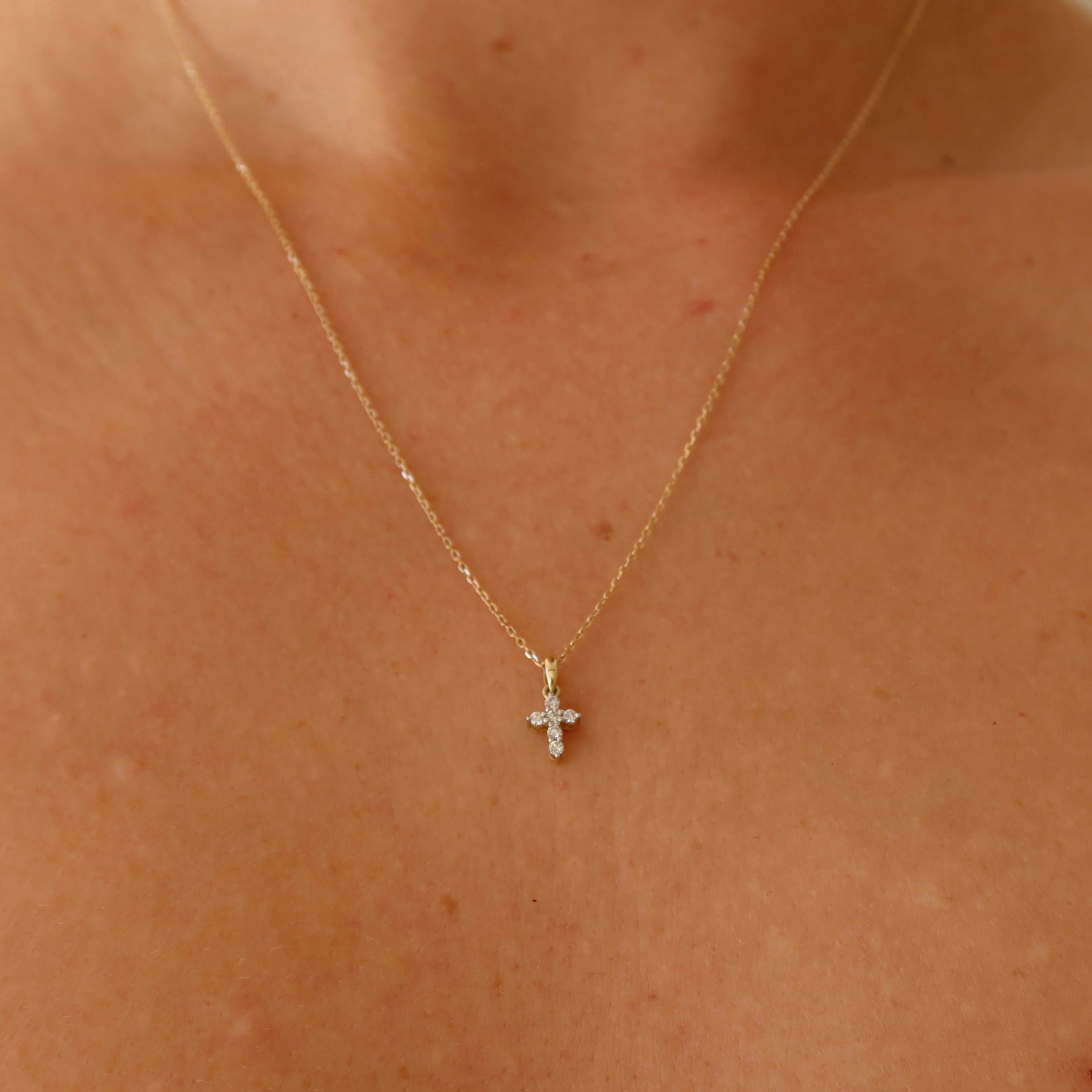 dainty 9 karat yellow gold oval link chain with mini diamond cross pendant