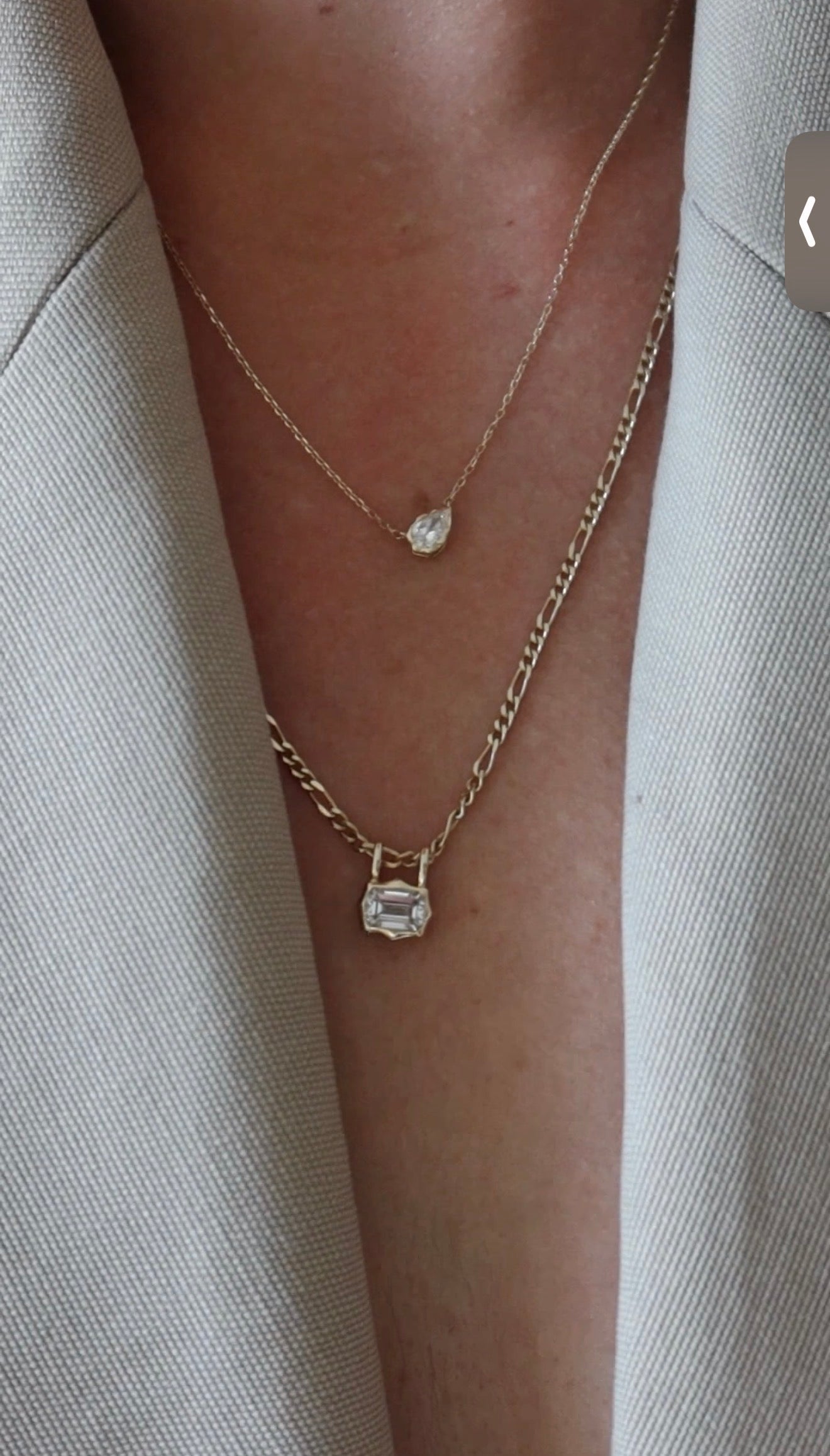 emerald cut diamond bezel pendant with double loop