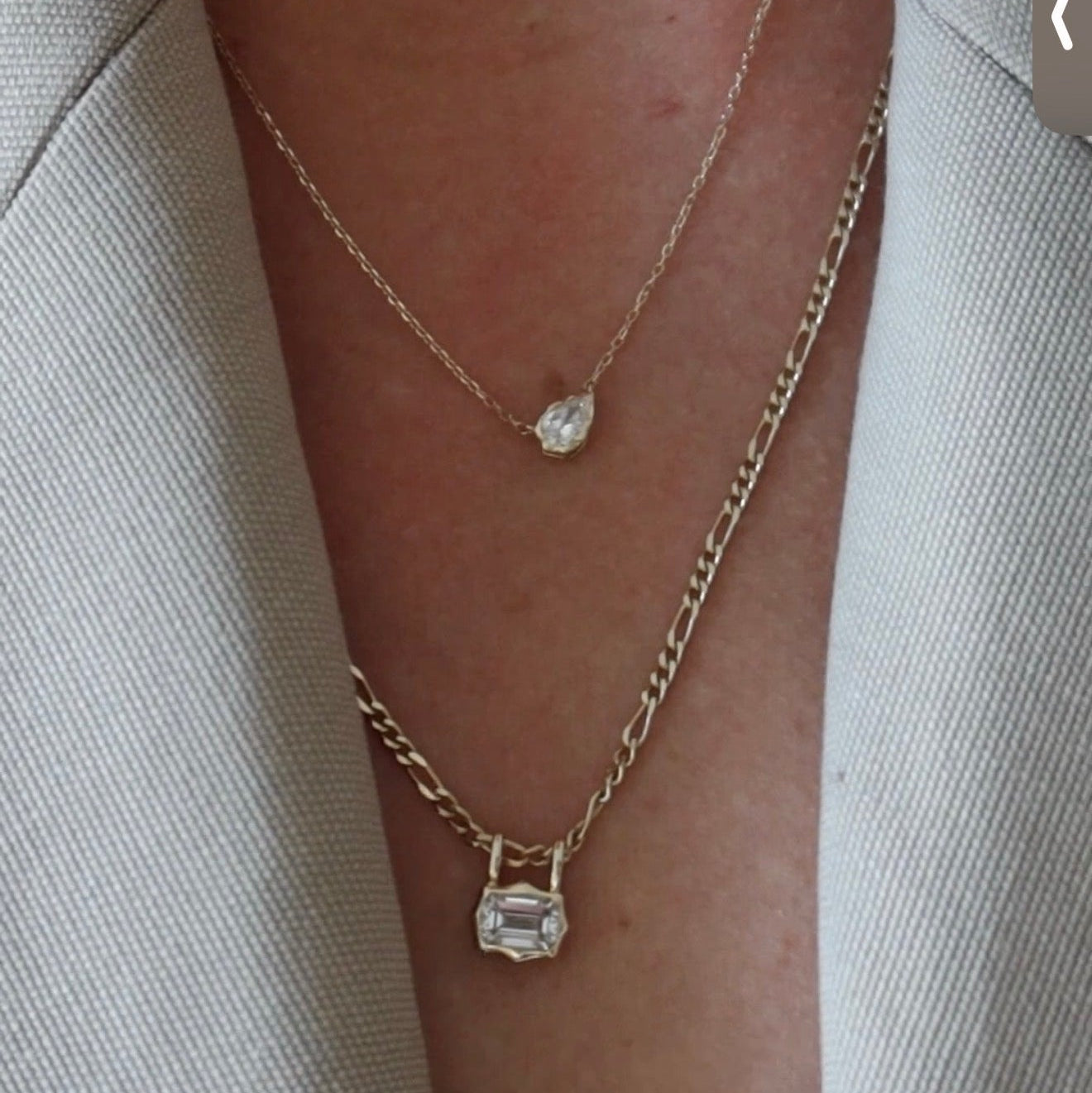 emerald cut diamond bezel pendant with double loop