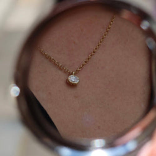 oval lab diamond pendant in 10 karat yellow gold