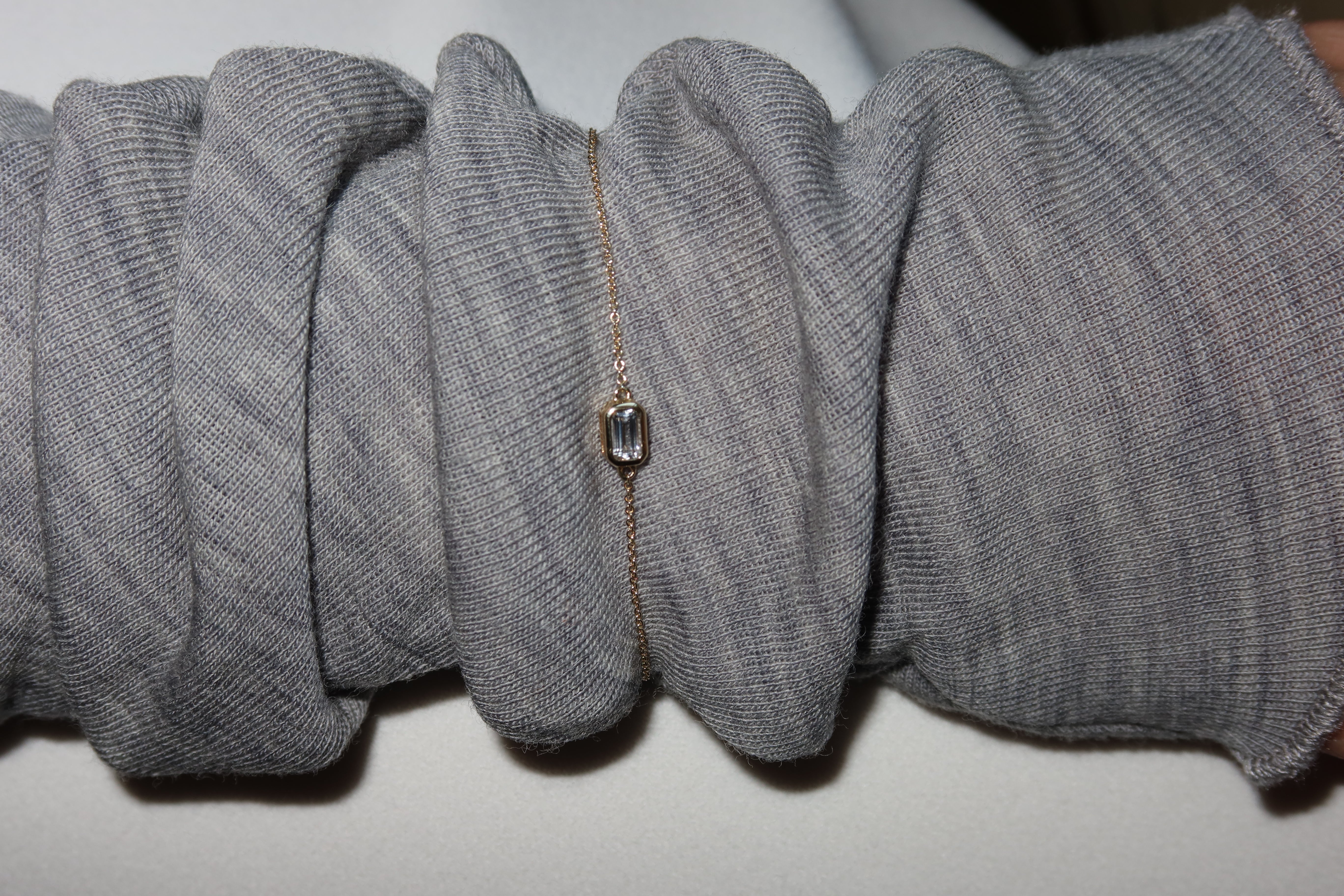 dainty solid gold bracelet with white sapphire